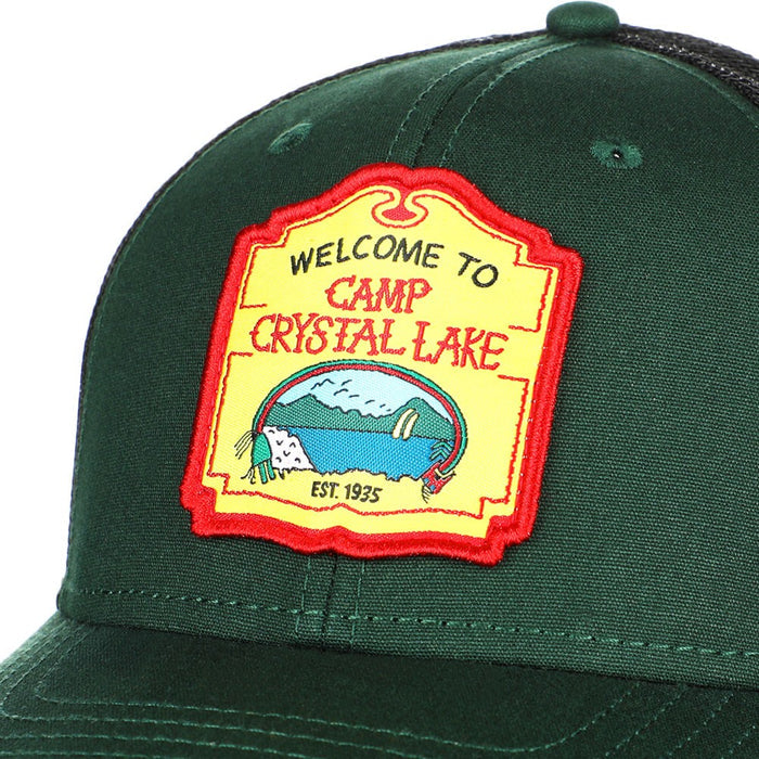 green hat with "welcome to camp crystal lake" patch on front center