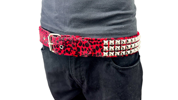 red leopard print belt worn by model on white background