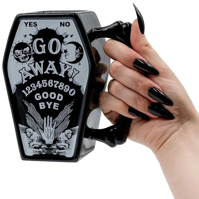 model holding mug