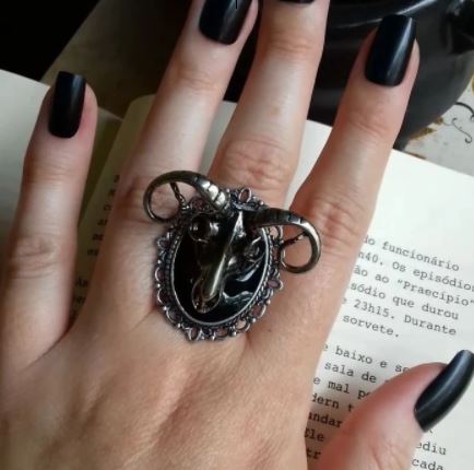 Zinc alloy silver colored large goat ram head skull ring.