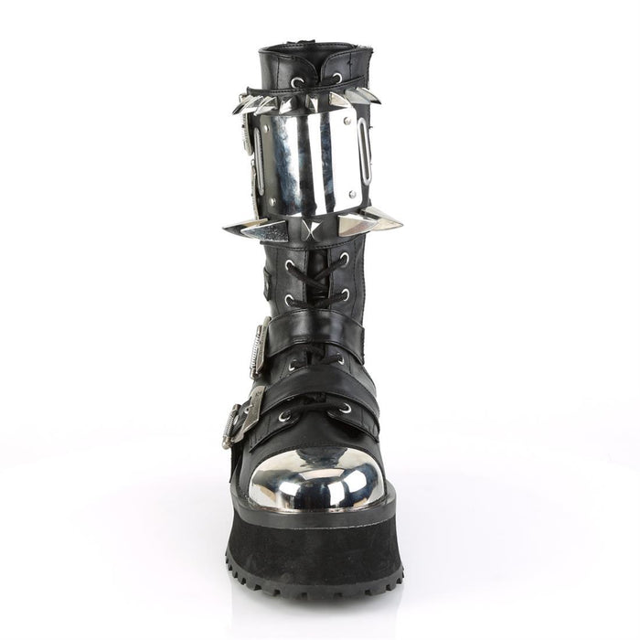 front side view of black vegan leather 3/4" platform Silver chrome plated metal toe cap Lace-up mid-calf boot Features buckle straps & cuff Features large silver chrome plate with large and small claw spikes and inside metal zip closure