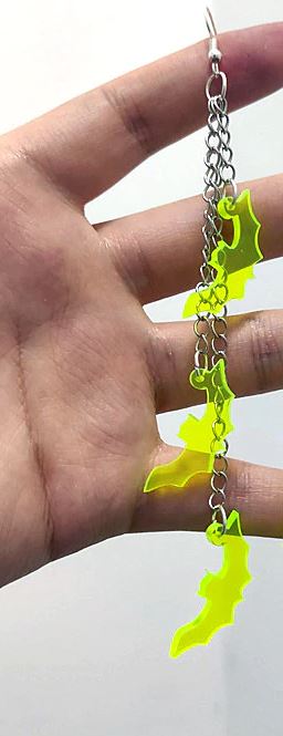 Three silver zinc alloy chains hanging from hook stud. Chains hang at different lengths with an acrylic green see-through bat hanging from each chain.