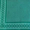 Green bandana with white polka dots pattern.