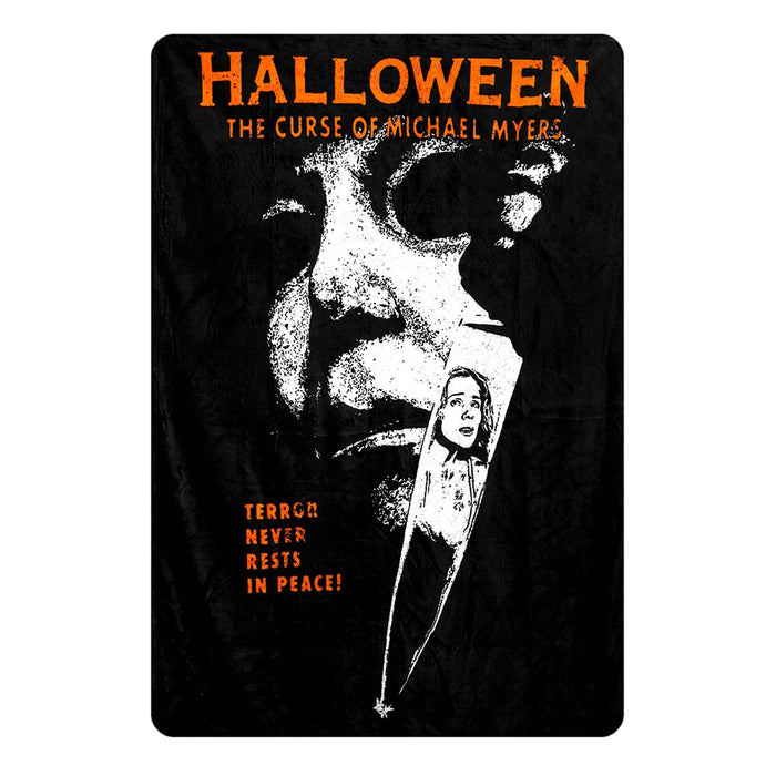 rolled halloween movie poster fleece throw blanket with text that reads "halloween the curse of michael myers. terror never rests in peace"