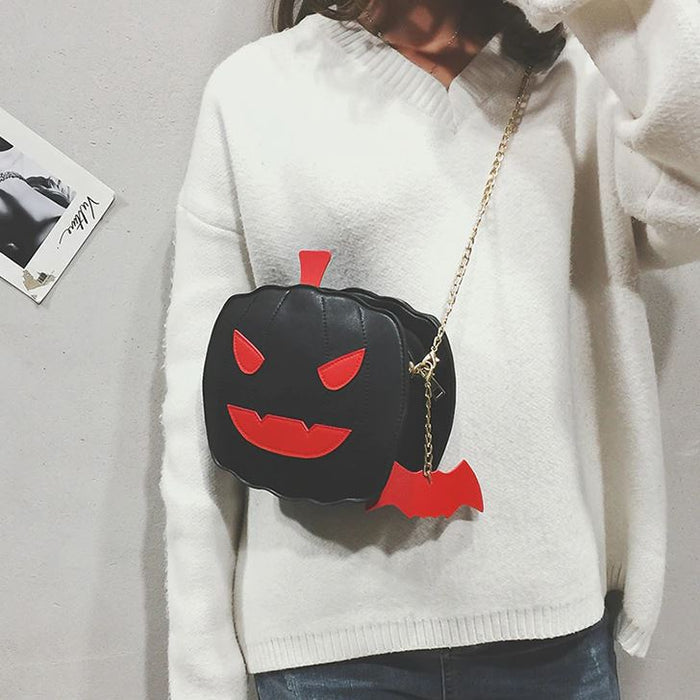 front view of black pumpkin jack o' lantern bag