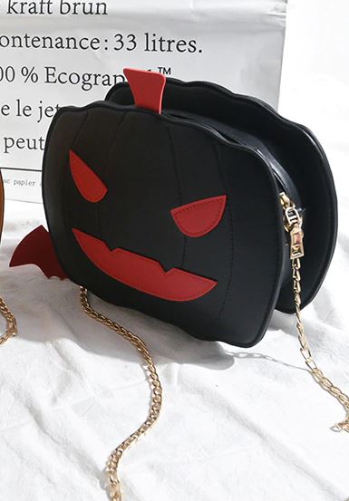 front view of black pumpkin jack o' lantern bag