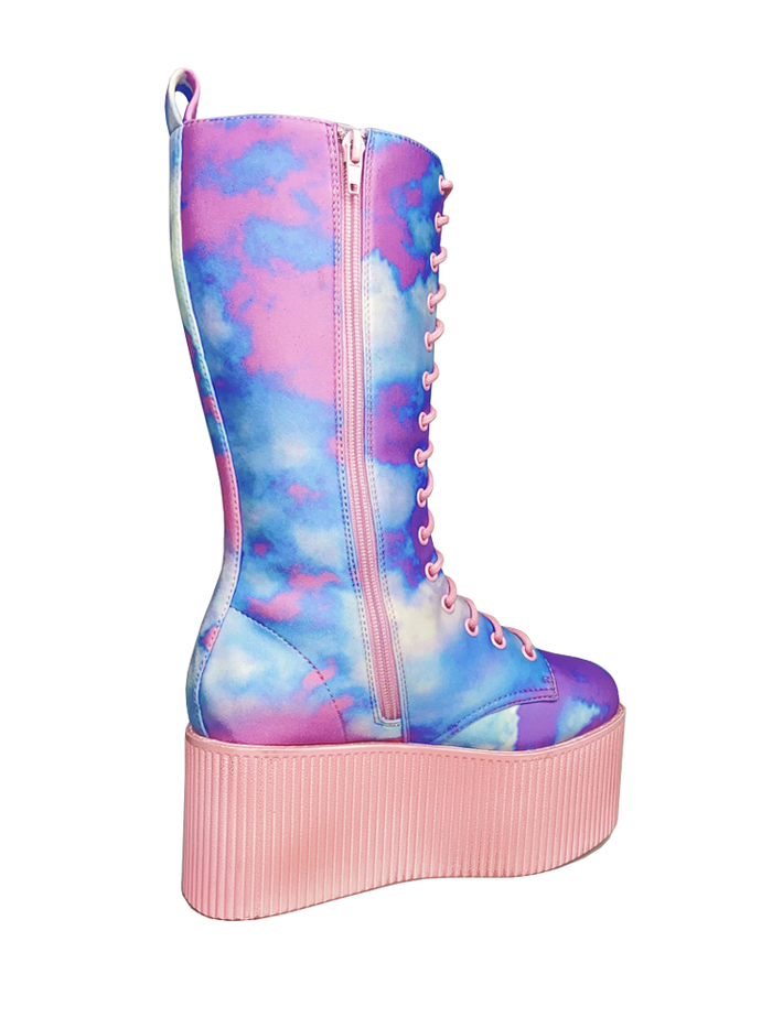 inner view of Printed blue, purple, pink pastel upper, pink molded outsole, pink enamel eyelets and pink round lace boot. Boot has full lace-up front and full inner side zip.
