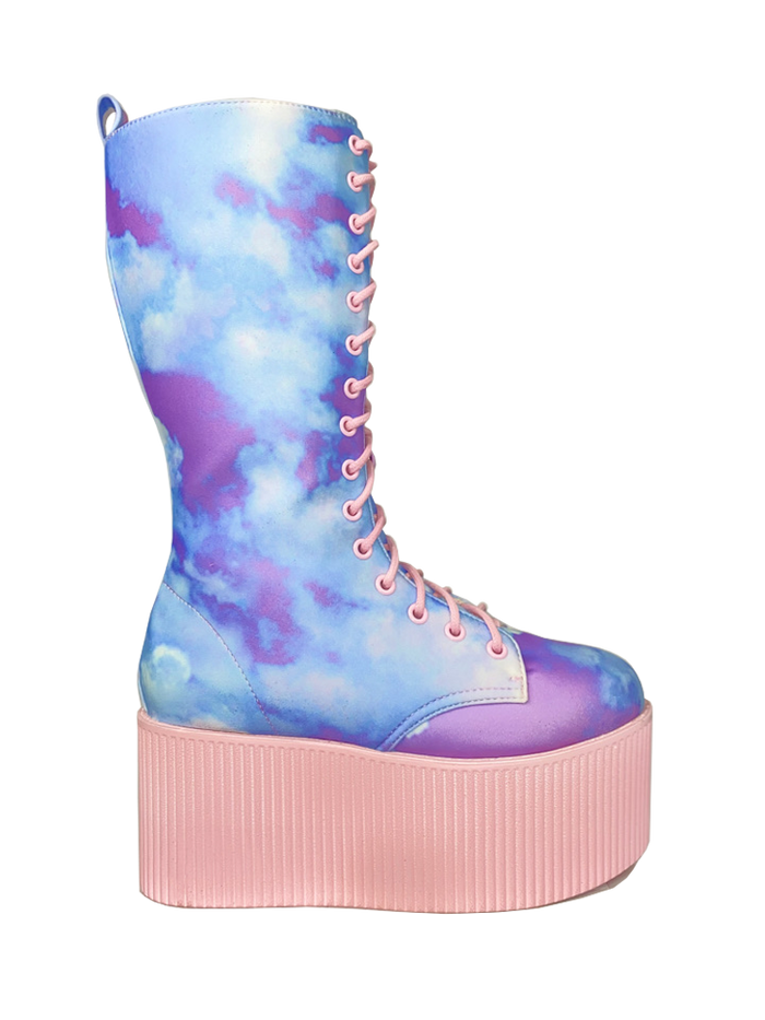 side view of Printed blue, purple, pink pastel upper, pink molded outsole, pink enamel eyelets and pink round lace boot. Boot has full lace-up front and full inner side zip.