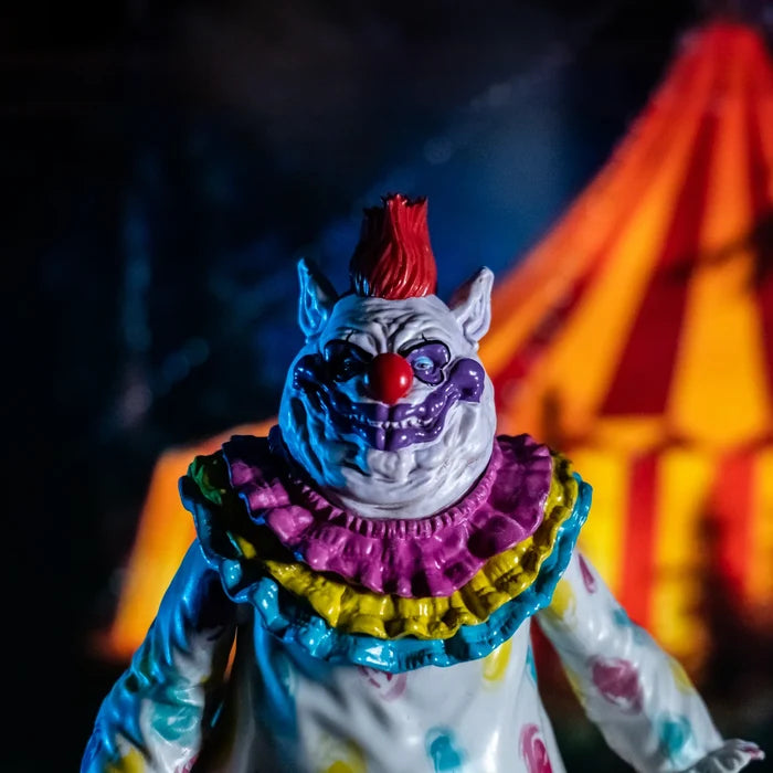 front of figure on display