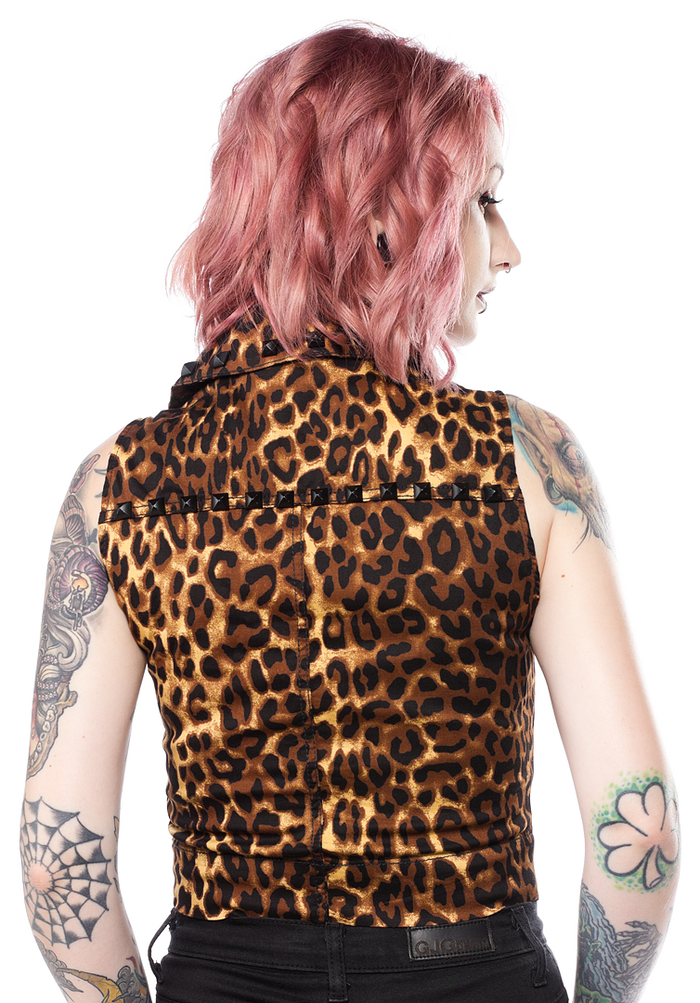 back view of Leopard print vest has the same shape and design as a moto jacket, with a zip up front and black studs around the collar.