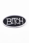Black patch with the word 'Bitch' in white on a white background