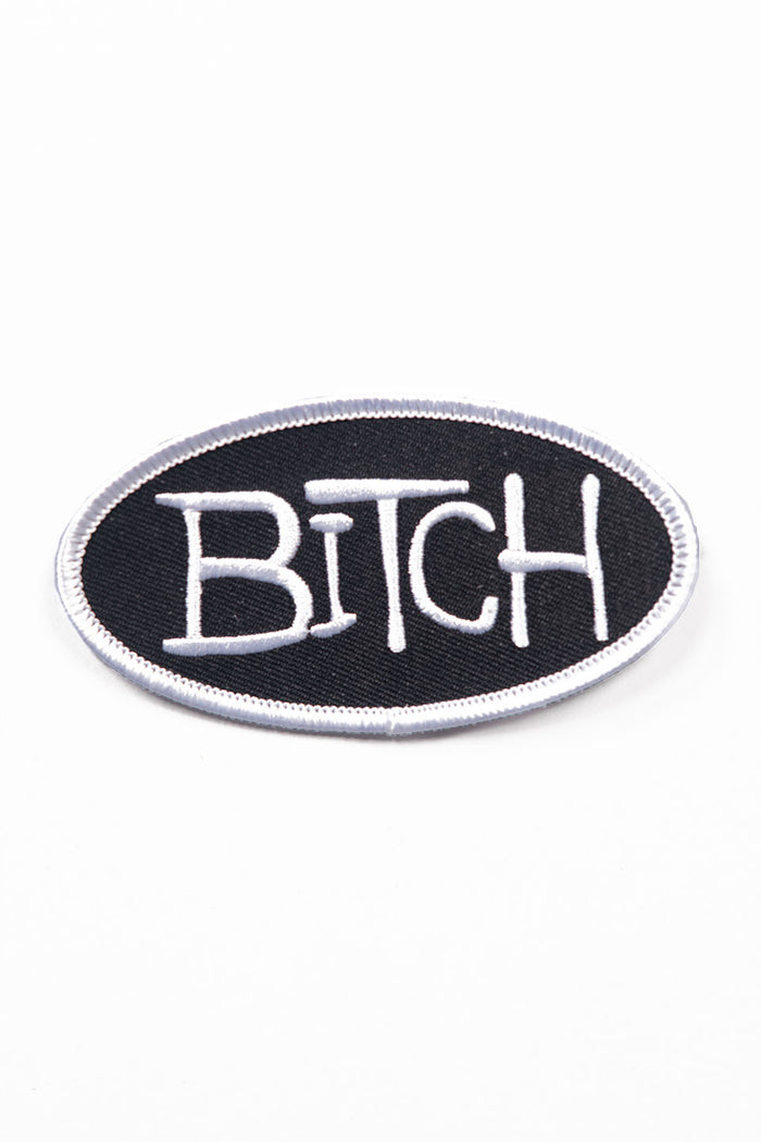 Black patch with the word 'Bitch' in white on a white background