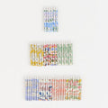 Set of colorful matchboxes with floral patterns on a white background