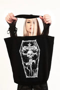 model holding tote bag