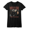 women's black motley crue shirt with picture of band leaning up against white brick wall with text that reads "smokin' in the boys room"