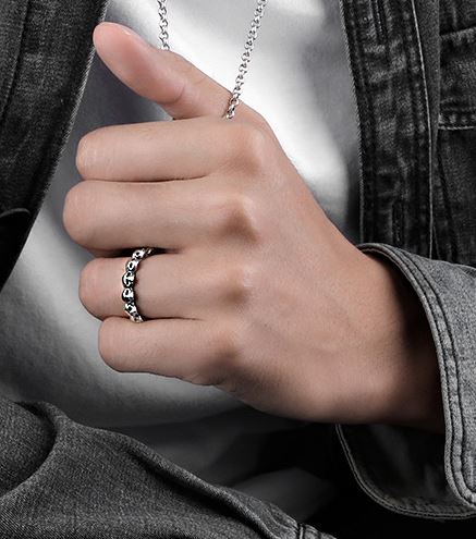 925 Sterling silver band ring with multi-skull design.