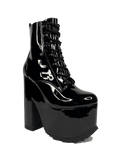 outer view of Black vegan shiny patent leather tall military style platform boot with black cotton laces and black inner zipper. Front of platform has a fanned grip for better stability when walking.