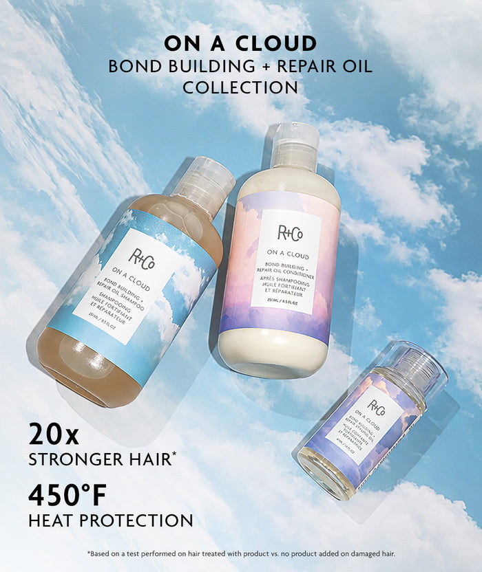 Three PHG hair repair oil bottles from the On a Cloud Bond Building + Repair Oil Collection are displayed against a sky and clouds background. The bottles feature blue, pink, and purple gradient labels, and the image includes promotional text highlighting stronger hair and heat protection.