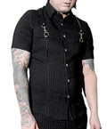 Model wearing a black and white pinstripe tip with tattoos on arms against a white background