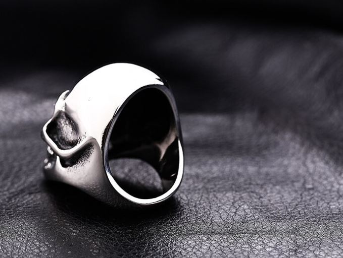 silver colored skull head ring