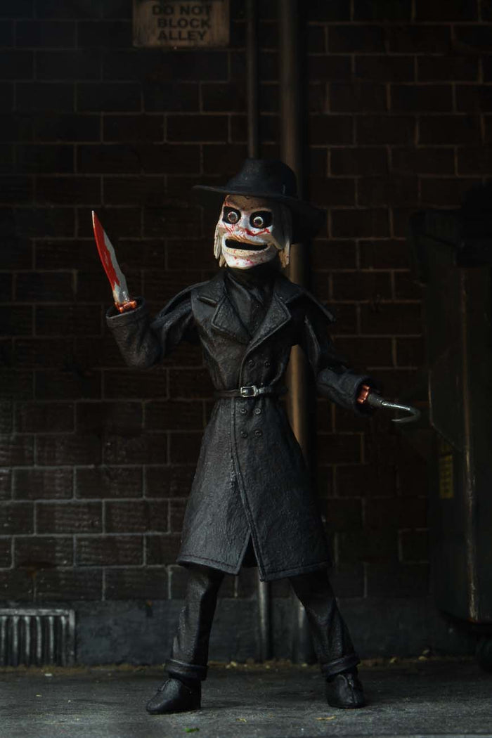 front of blade, close up with blood spatter on his mask and knife