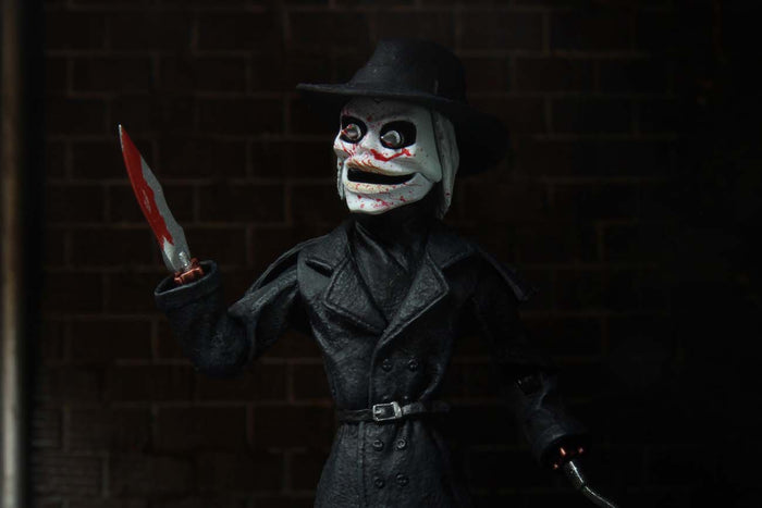 front of blade, close up with blood spatter on his mask and knife