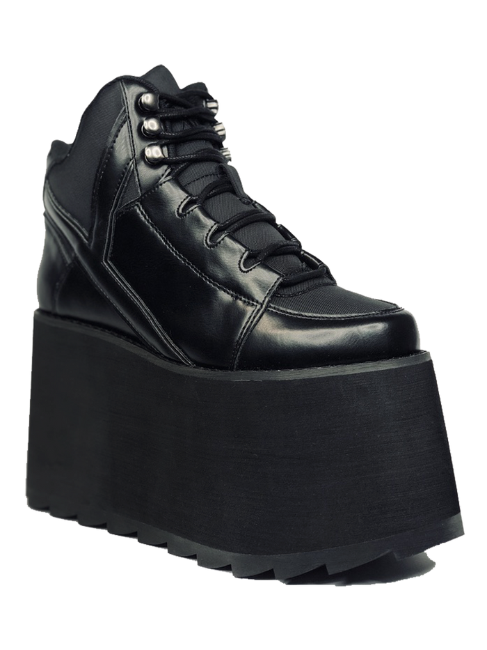 outer view of black vegan leather platform shoe with EVA platform. Shoe looks like a sneaker, but super tall! Shoe has nylon details and mesh lining. Bottom of platform has a "fanned" grip to make the platform more stable.