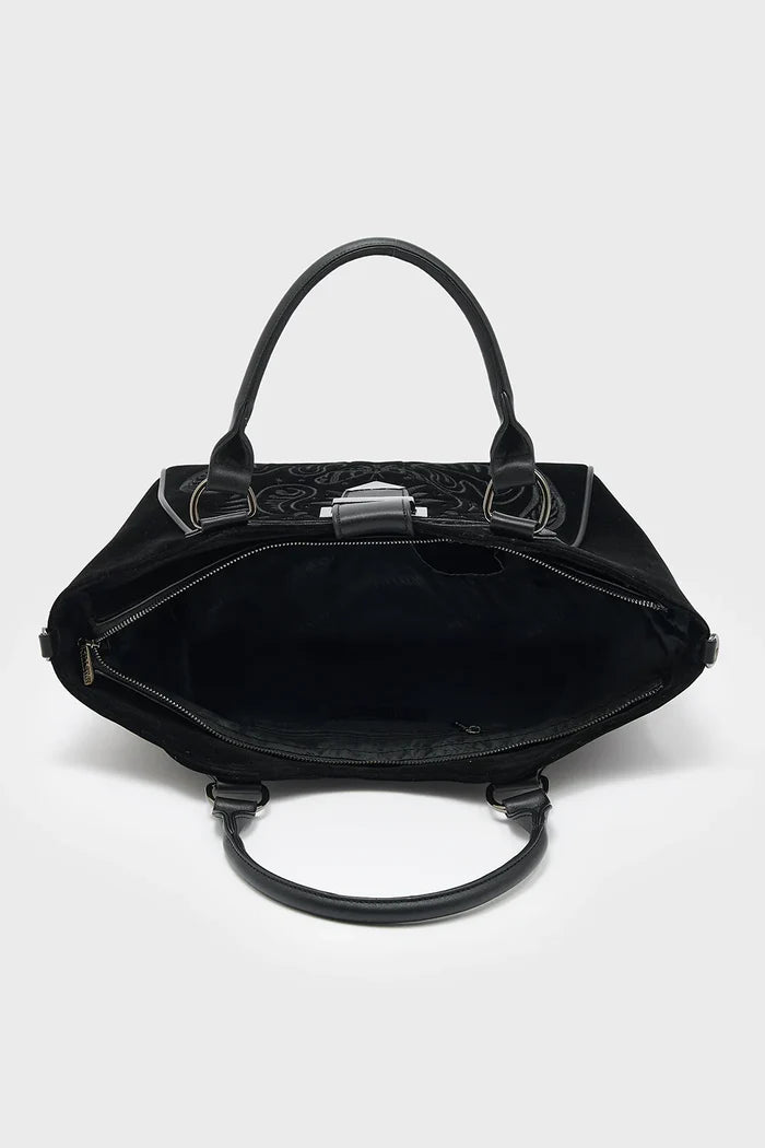 Black handbag with open lid on a white background