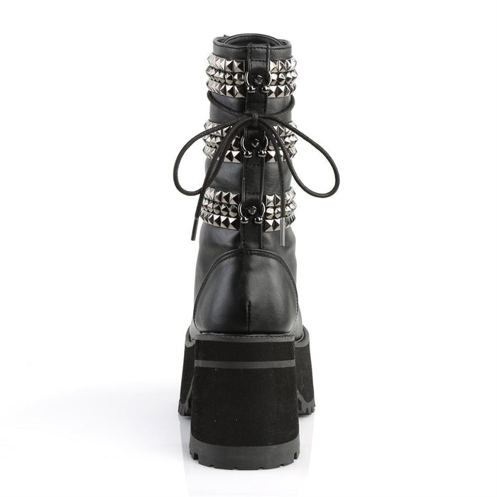 back side view of Black vegan leather 3 3/4" heel, 2 1/4" platform lace-up front ankle boot, with triple studded ornamental straps and pyramid stud & horseshoe rings at back.