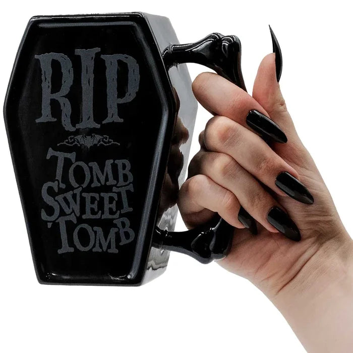 model holding mug