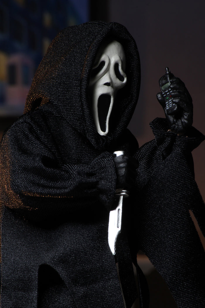 figure on display with cellphone