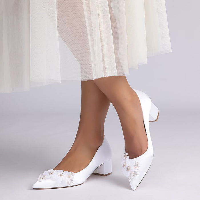 Elegant flower appliqué wedding heels in white with delicate embellishments for bridal footwear