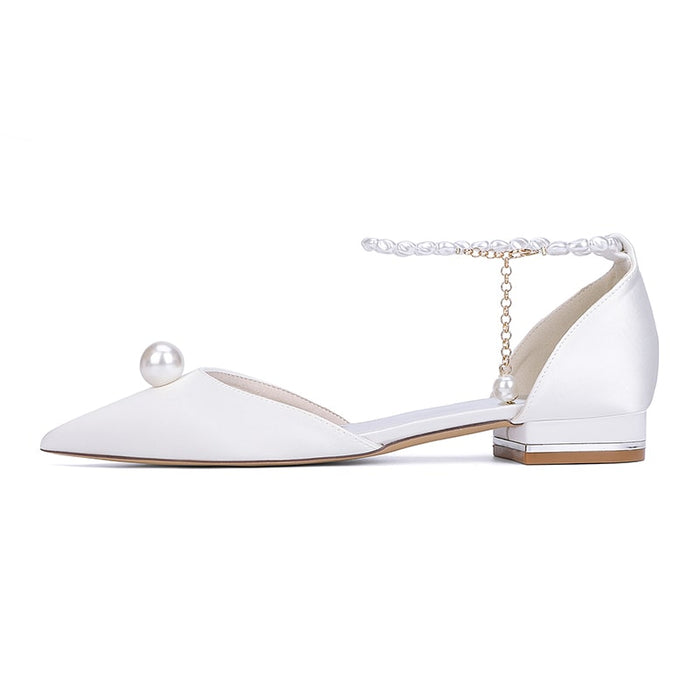 Elegant satin wedding flats with pearls featuring a stylish ankle strap and low heel