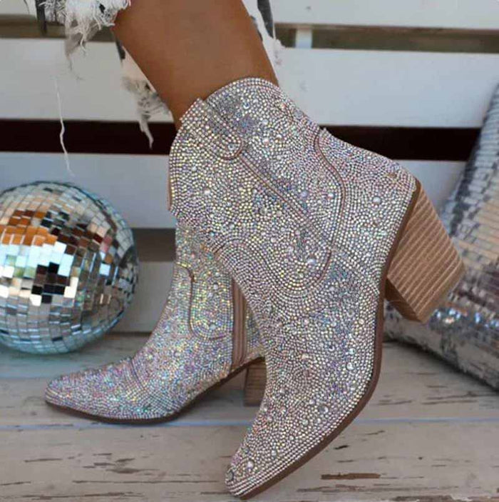 Stylish sparkly cowboy boots featuring rhinestone detailing and a stacked heel for a trendy look