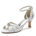 Elegant women's glitter ankle strap sandals in white with a jeweled embellishment and stylish design