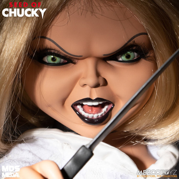 Tiffany doll is outfitted in an all-white gown and choker necklace. Doll comes complete with a knife accessory that fits nearly in her right hand.