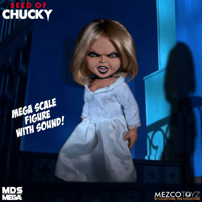 Tiffany doll is outfitted in an all-white gown and choker necklace. Doll comes complete with a knife accessory that fits nearly in her right hand.