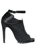 outer side view of 6" heel sandal with adjustable ankle strap and woven nylon upper and sides with vegan leather details.