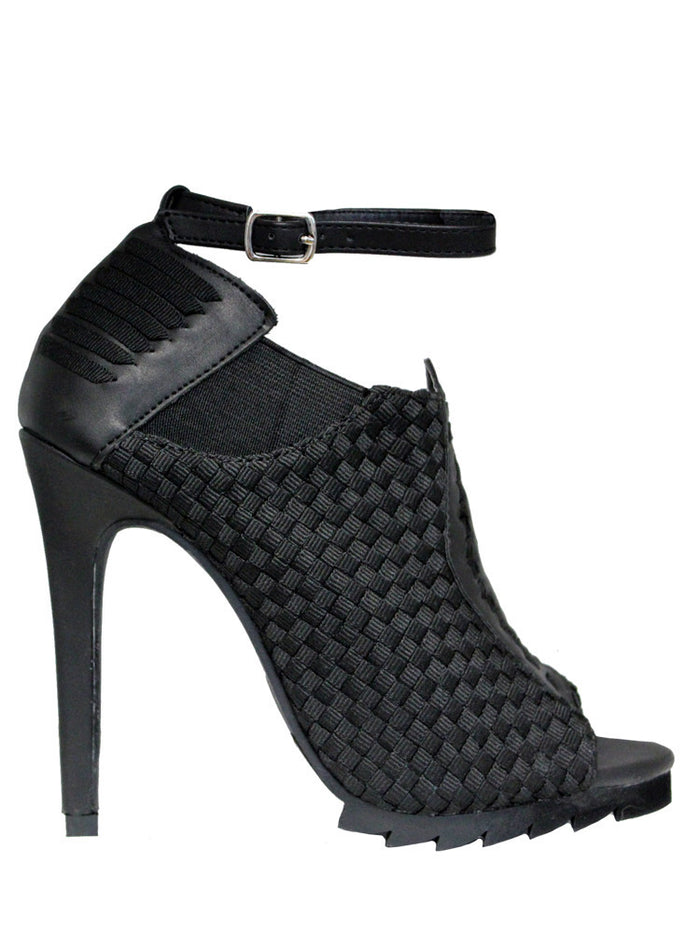 outer side view of 6" heel sandal with adjustable ankle strap and woven nylon upper and sides with vegan leather details.
