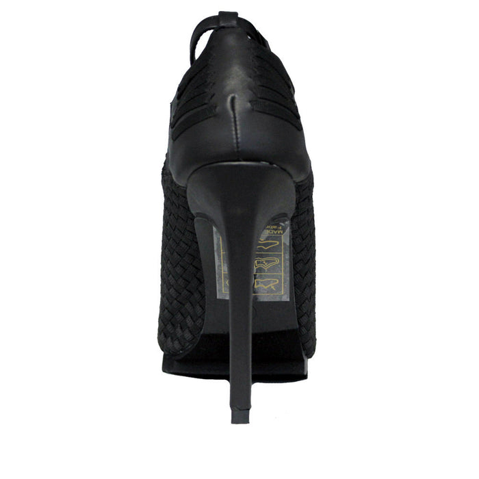 back side view of 6" heel sandal with adjustable ankle strap and woven nylon upper and sides with vegan leather details.
