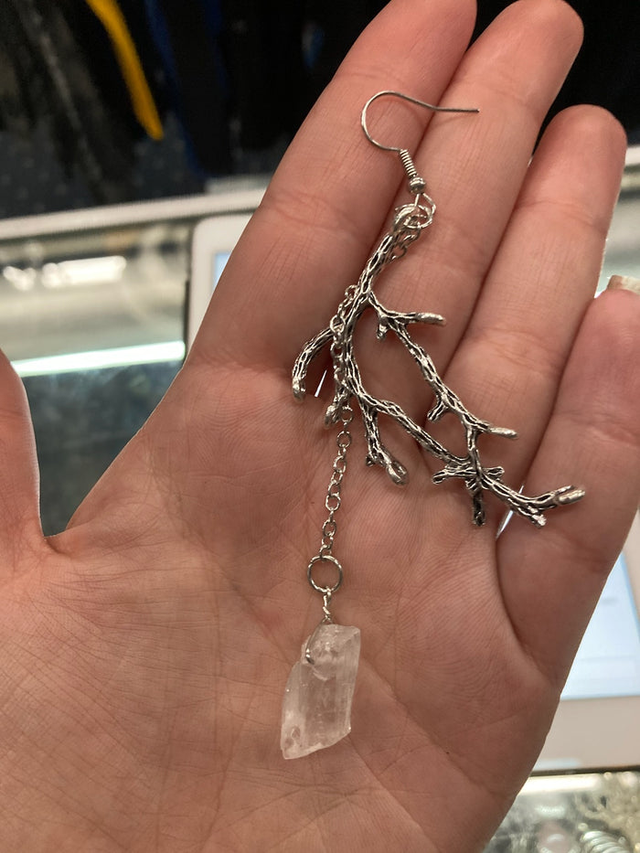 model holding earring