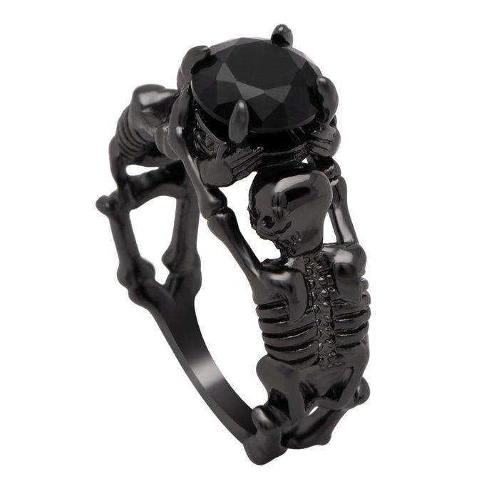 Black skeleton band and large black cubic zirconia on top center.