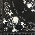 Black bandana with skull and crossbones paisley print.