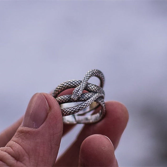 Silver colored zinc alloy snake wrap around ring.