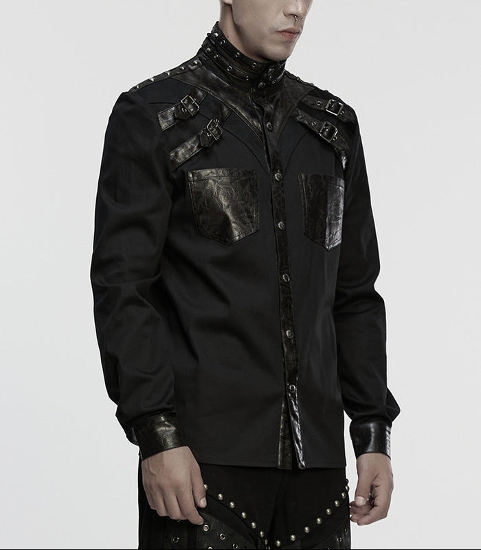 Person wearing a black, ornate shirt on a white background