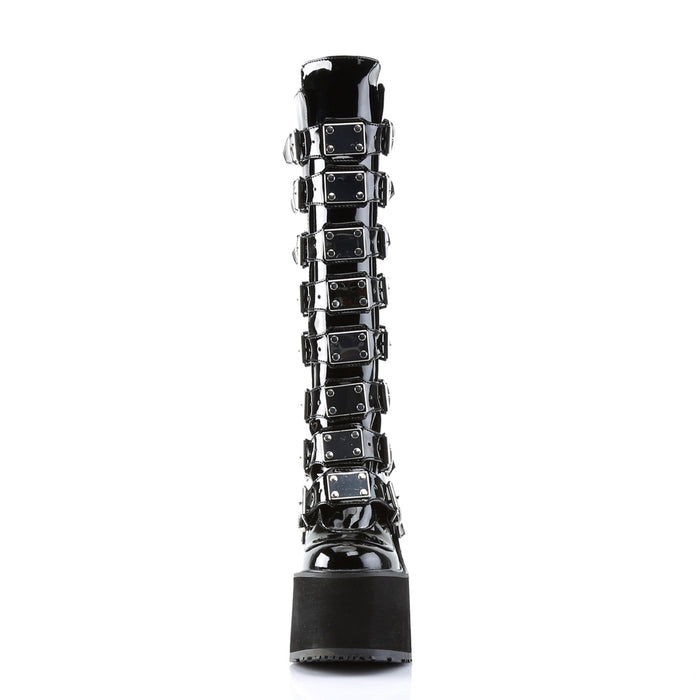 front view of black vinyl 5 1/2" wedge platform Goth punk gogo knee high boot Adjustable straps from top to bottom of boot, with metal plates up the front with full back zipper