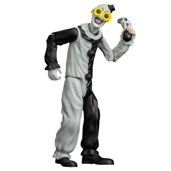 Clown figurine with yellow glasses holding a horn on a white background