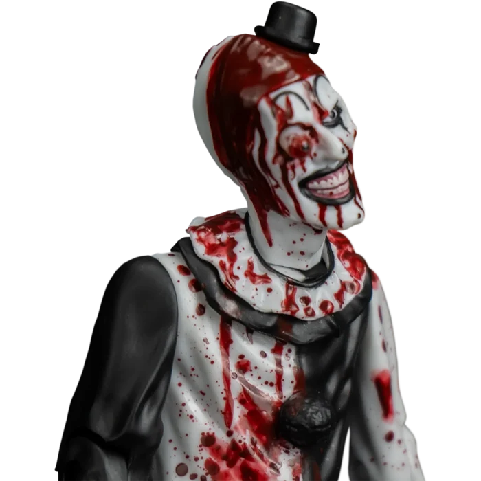 Action figure of a clown with bloodstains on a white background