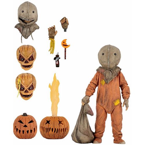 figure on display with accessories and interchangeable heads