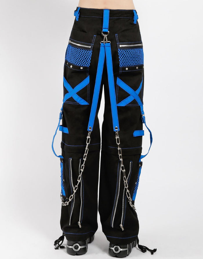 back of Black and blue studded pants zip off into shorts and feature removable chains, adjustable ankles, zippers, D-rings, and deep pockets.